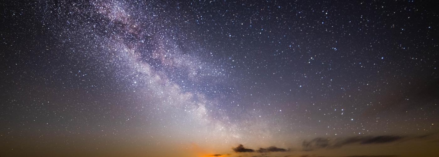 Moon rising under Milky Way