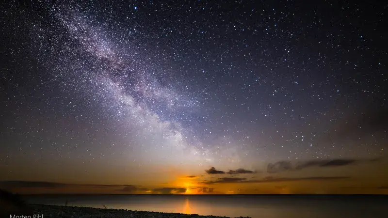 Moon rising under Milky Way
